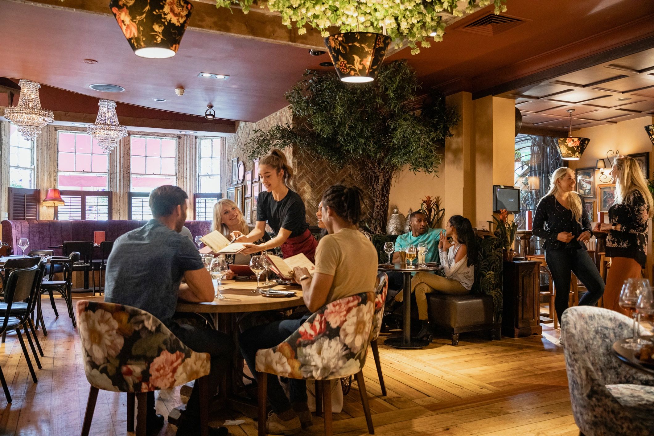 Guests dining in a warm restaurant interior