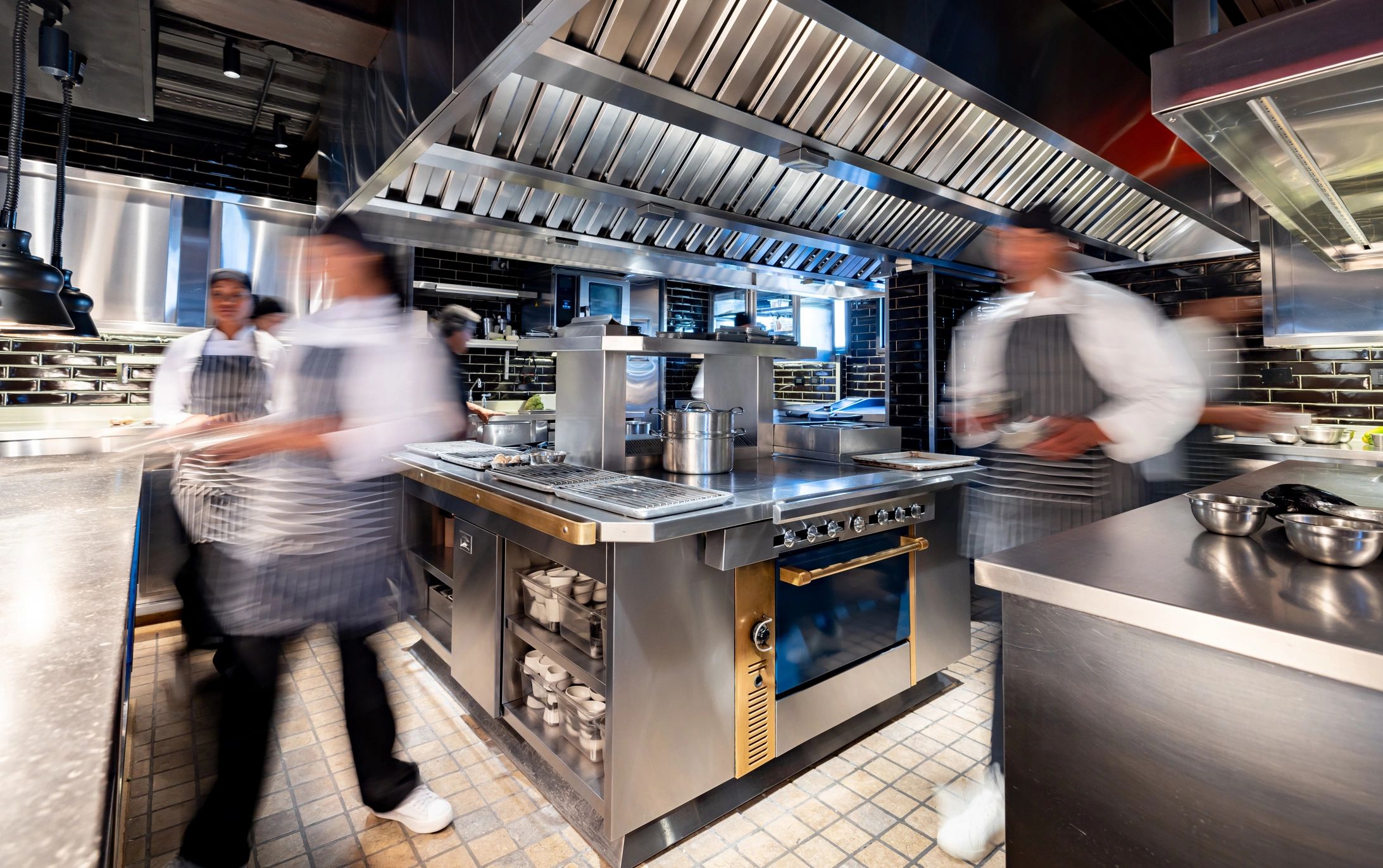 Chefs and cooks working in a hectic kitchen